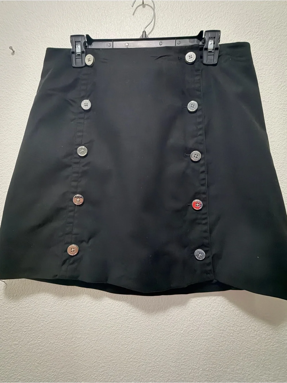 Michael Kors black lined mini skirt with double row silver buttons